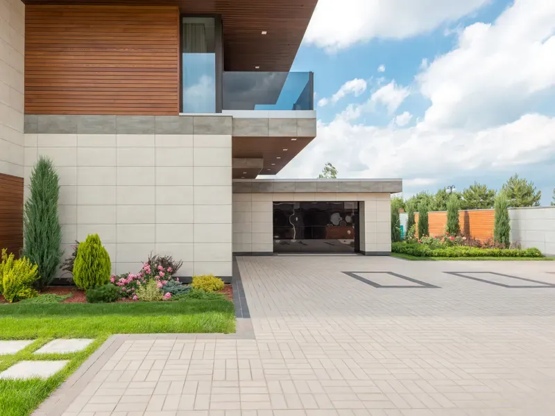House exterior with a poured concrete driveway