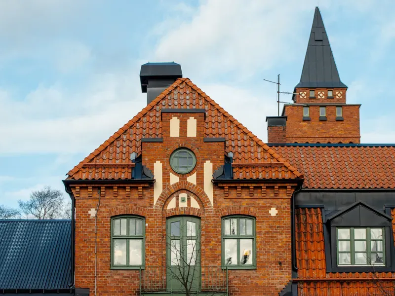 Steep-pitched roofline on a brick building