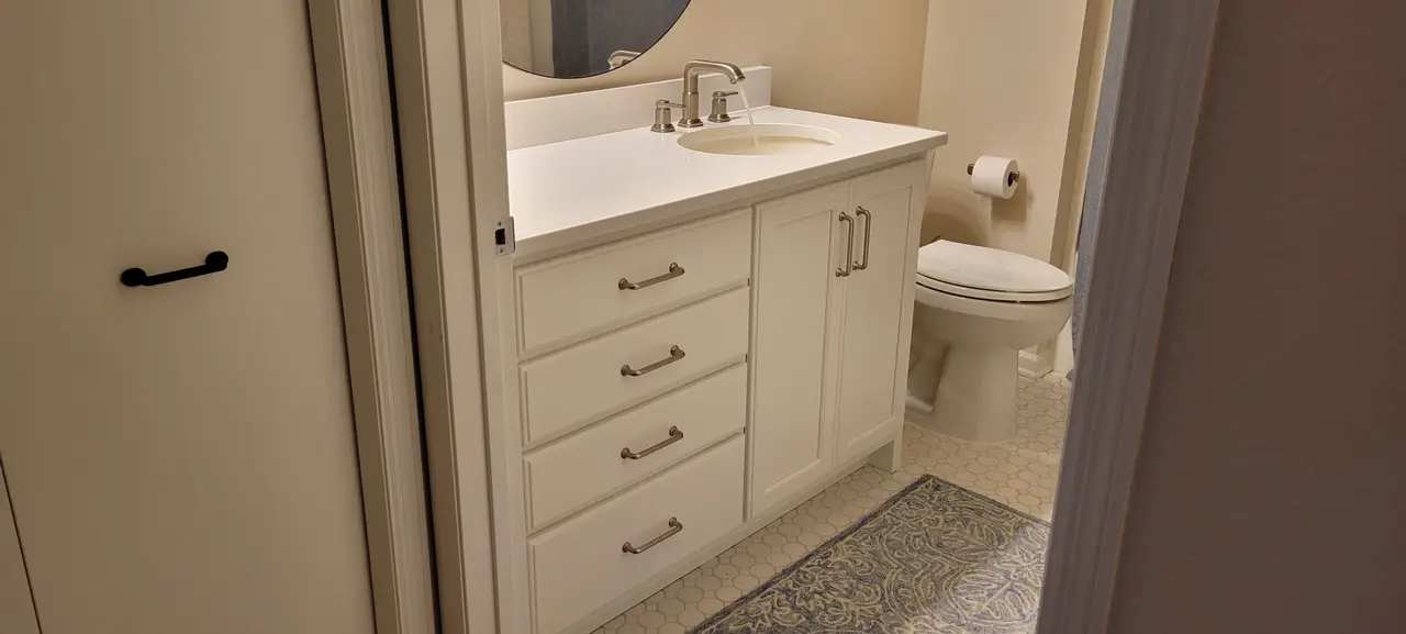 Remodeled bathroom vanity and mirror