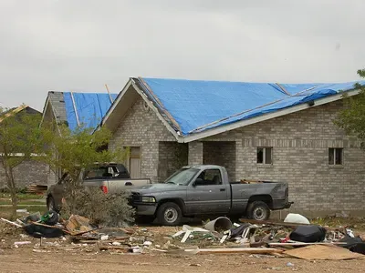 16-mil heavy-duty poly tarp + 2x4s